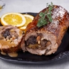 Christmas pork roll with dried fruits and butter sauce